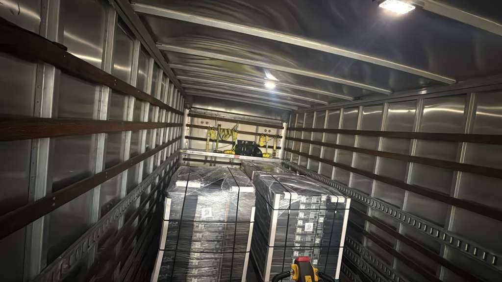 Bulk refurbished computer inventory in shipping container